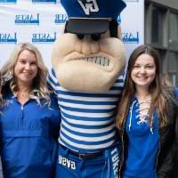 Louie the Laker poses with group of alumni